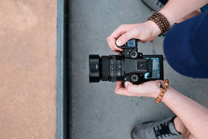 A photographer holding a Dslr camera